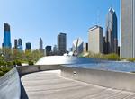 Walk across BP Bridge in Millennium Park, Chicago