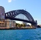 Looking northward from The Rocks to Sydney Harbour Bridge and the luxurious Park Hyatt. Autumn day mid afternoon.