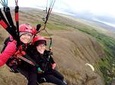 Tandem Paragliding over the Rugged Lava Fields at Blue Mountains