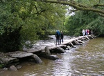Walk across Tarr Steps, Exmoor National Park, England