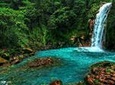 Celeste river waterfall and volcano guided rainforest hike and exuberant wildlife watching tour at Arenal in La Fortuna