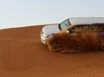 Dubai Desert Safari with BBQ And 4W Land Cruiser Dune Bashing Experience-Sandboarding