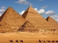 Camel Ride around the Pyramids During Sunrise Or Sunset