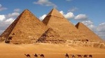 Camel Ride around the Pyramids During Sunrise Or Sunset