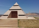 See Official Center of the World Pyramid Monument, Felicity, California
