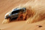 Evening Desert Safari with Dune Bashing, Camel Riding, BBQ Dinner