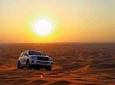 Sun Rise Desert Safari & Sandboarding Camel Ride