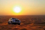 Sun Rise Desert Safari & Sandboarding Camel Ride