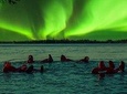 Ice Floating in Forest Lake with Aurora Borealis