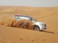 Sunrise Red Dunes Drive with Sand Boarding & Camel Ride 