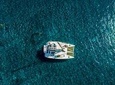 Santorini Half Day Private Catamaran Cruise with Food, Drinks & Free Transport