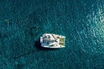 Santorini Half Day Private Catamaran Cruise with Food, Drinks & Free Transport