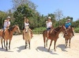 Horseback ride with atv, 6 zip lines, swim in cenote with lunch and transportation
