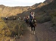 Horseback riding at sunset