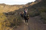 Horseback riding at sunset