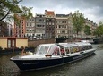 Audio guided tour on a covered boat through the canals of Amsterdam