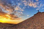 sunset at Giza pyramids by camels 