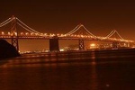 Experience San Francisco at Night in a Luxury SUV with a glass of champagne