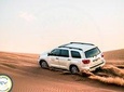 Exclusive Sunrise Desert Safari with Camel Ride Sand Boarding Dune Bashing