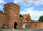 Visit Brama Mostowa (Bridge Gate), Toruń, Poland