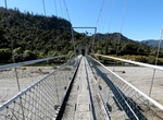 Cross Punakaiki River Swing Bridge, Paparoa National Park, New Zealand