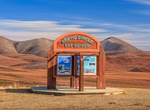 Stand on Arctic Circle along Dempster Highway, Yukon, Canada